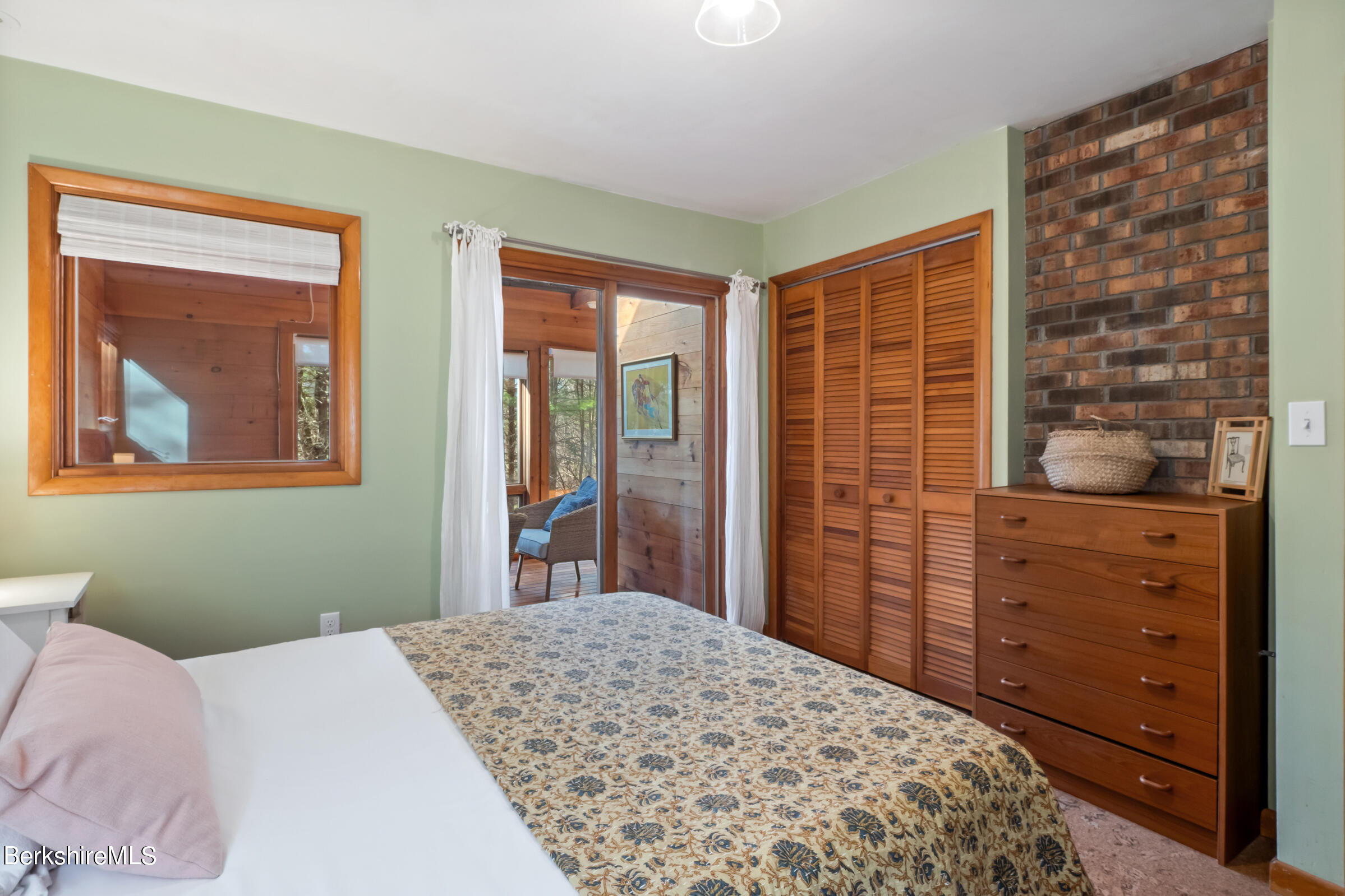 11 Pine Knoll Road Lenox, MA 01240 - Photo 29 of 35 a bedroom with a bed and a dresser