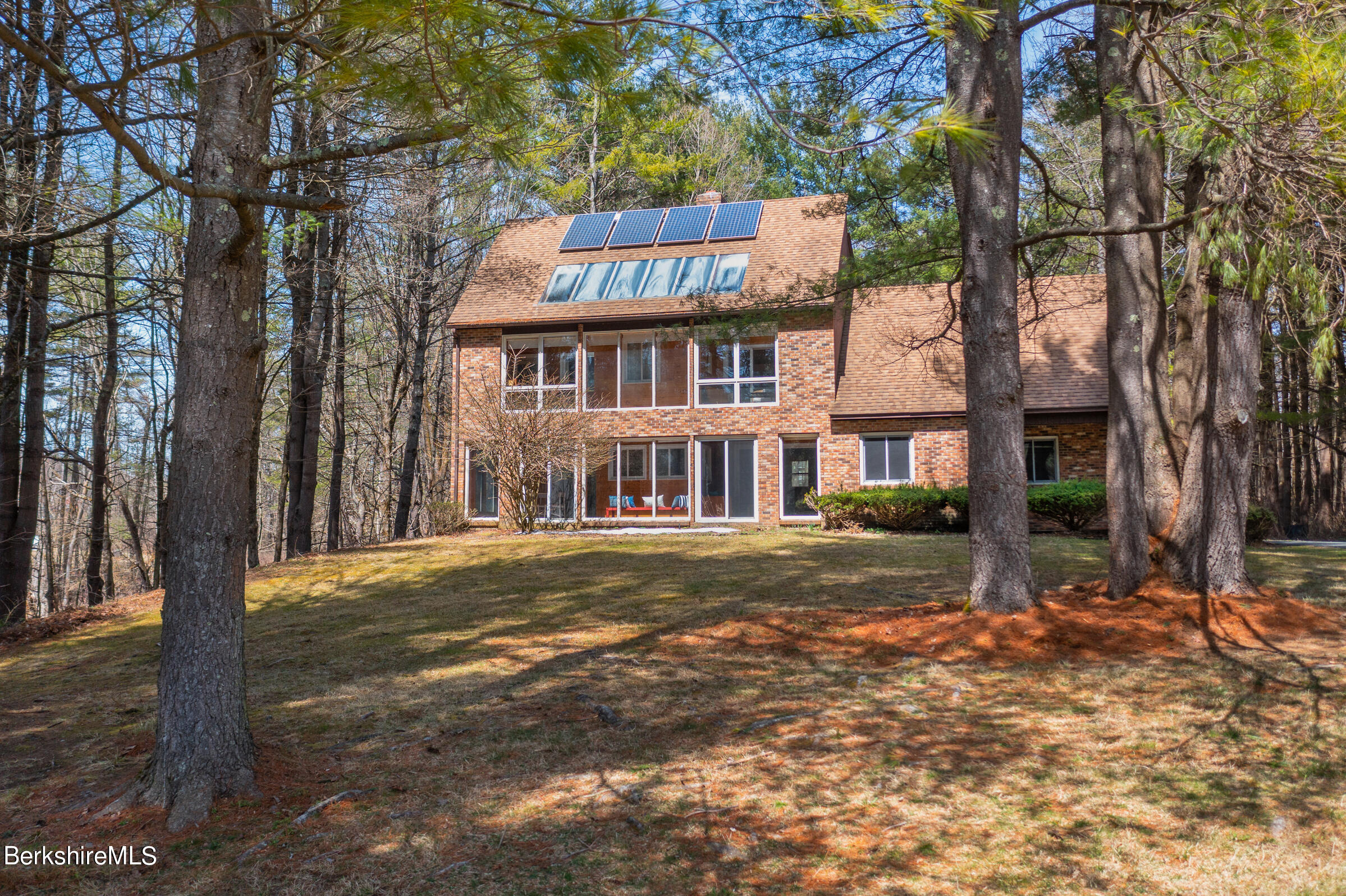 11 Pine Knoll Road Lenox, MA 01240 - Photo 3 of 35 a front view of a house with a yard