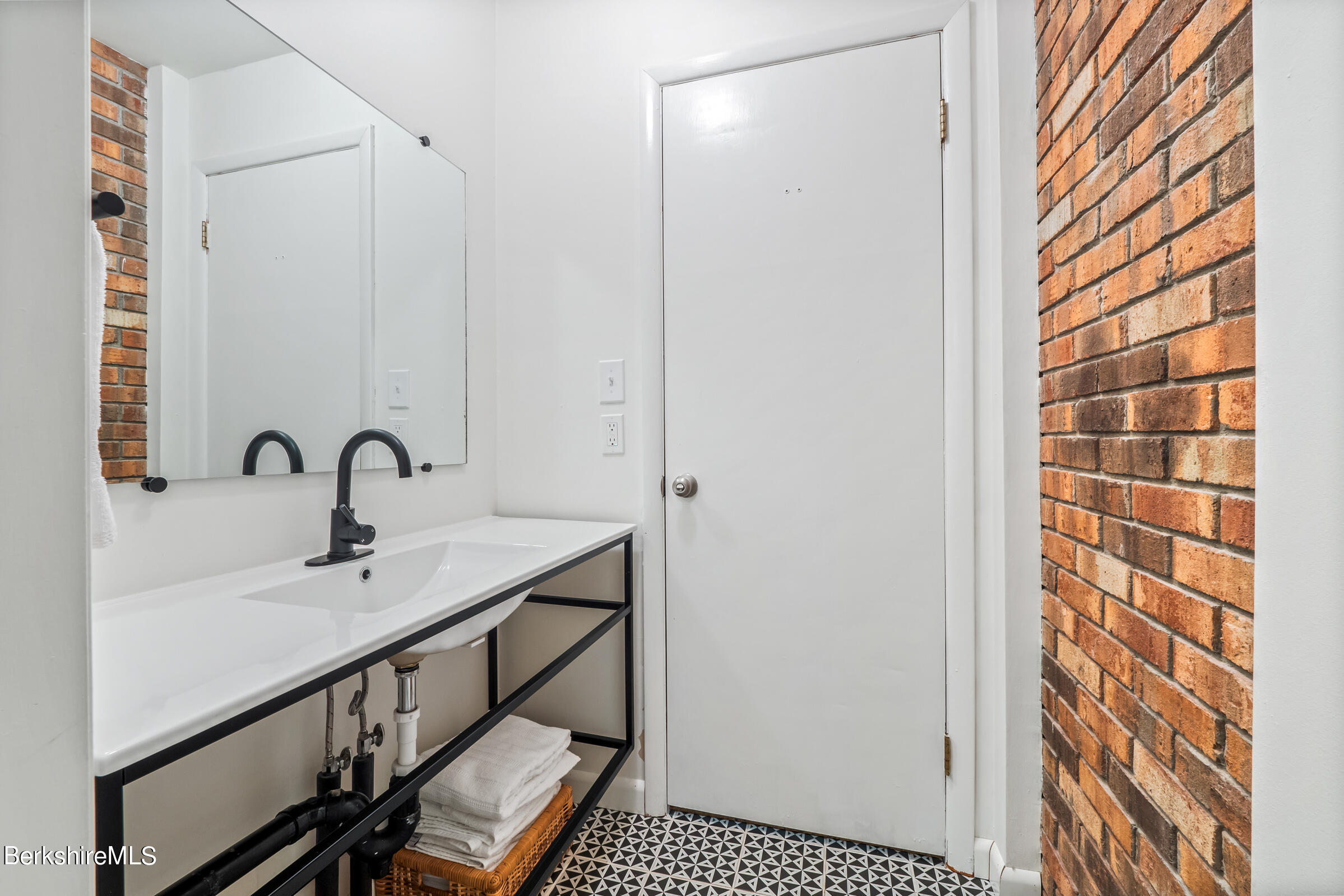 11 Pine Knoll Road Lenox, MA 01240 - Photo 34 of 35 a bathroom with a sink and a mirror