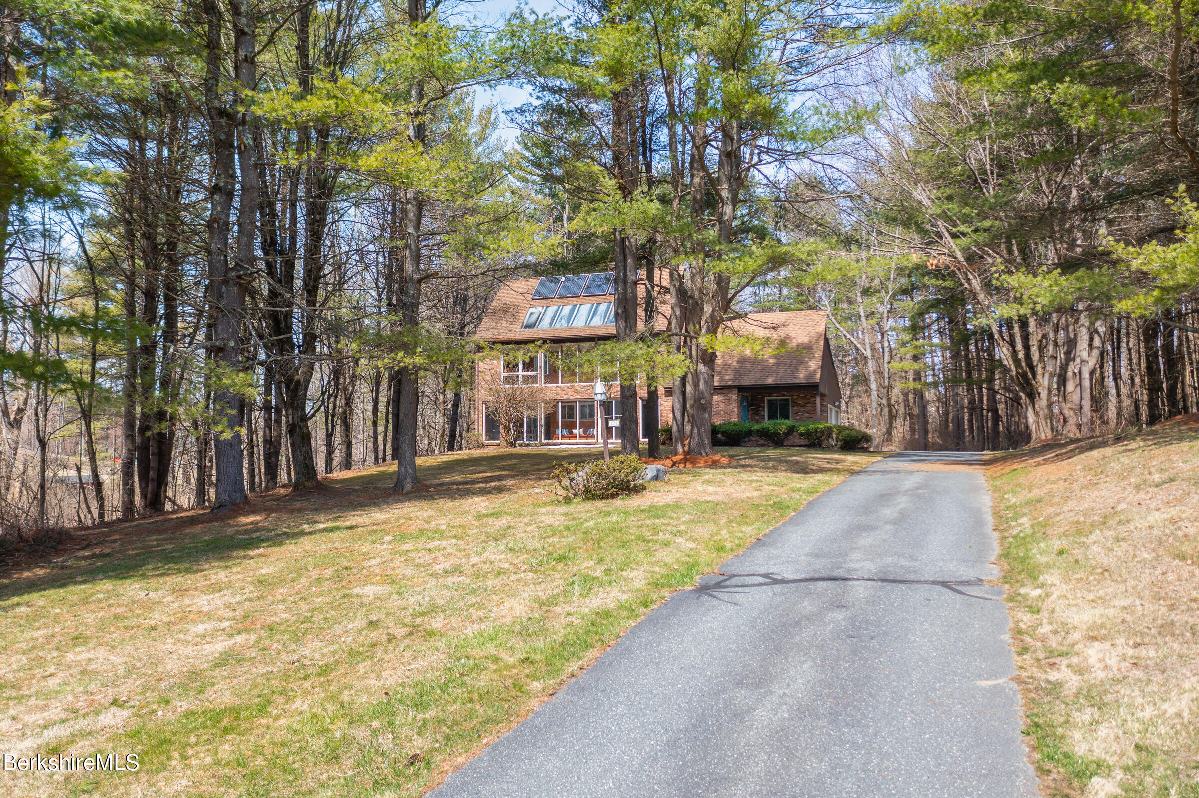 11 Pine Knoll Road Lenox, MA 01240 - Photo 4 of 35 a swimming pool with outdoor seating and yard