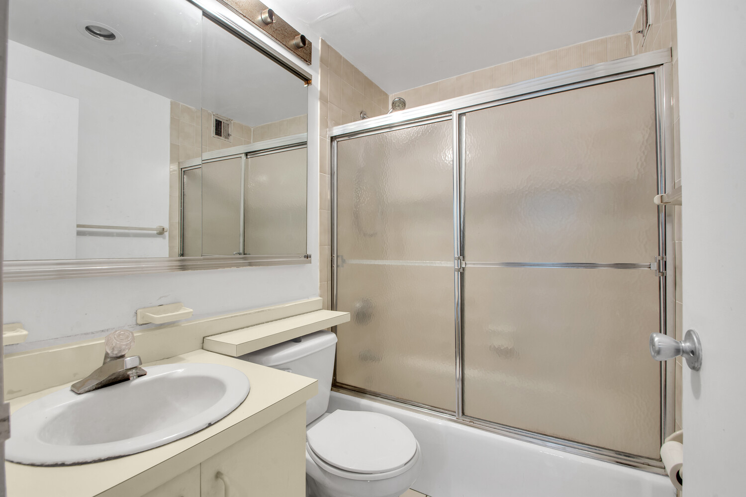 414 West 54th Street, Unit 5C Manhattan, NY 10019 - Photo 7 of 8 a bathroom with a sink toilet and shower