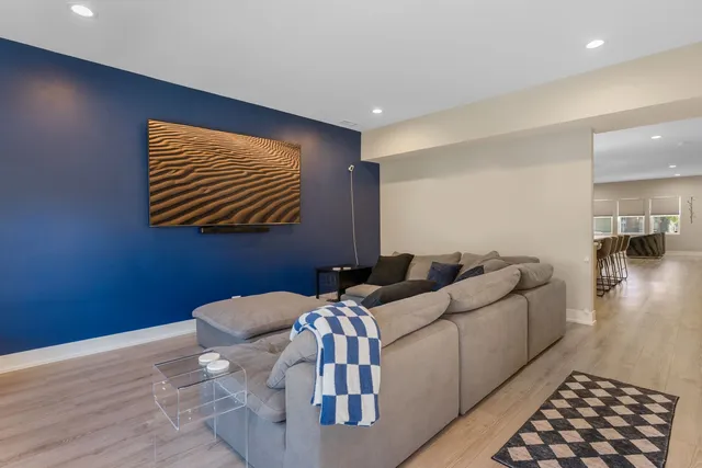 a living room with furniture and a gate