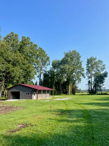 a view of a house with a big yard