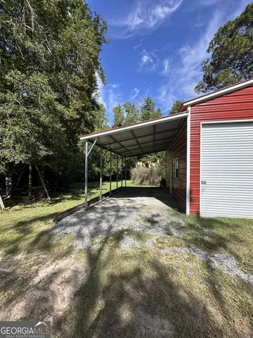 a view of backyard and basketball court