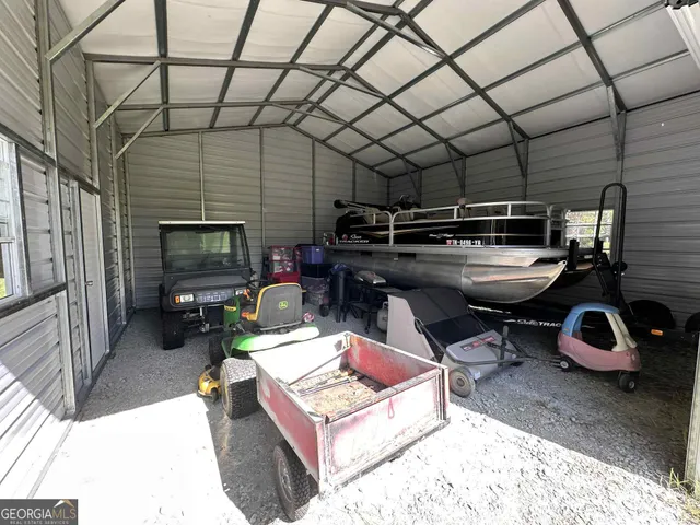 a living room with furniture a flat screen tv and gym equipment
