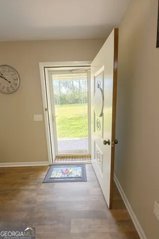 a view of an empty room with a window