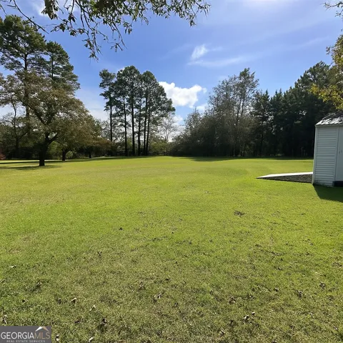 a view of an ocean yard and mountain view