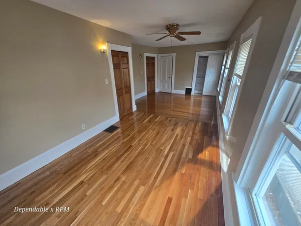 a view of entryway with wooden floor