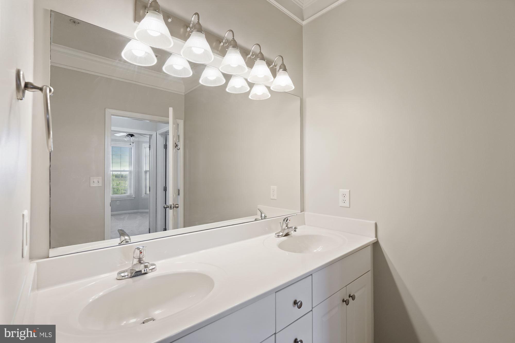 512 Sunset View Terrace Southeast, Unit 406 Leesburg, VA 20175 - Photo 18 of 34 Hall bath with double sink vanity