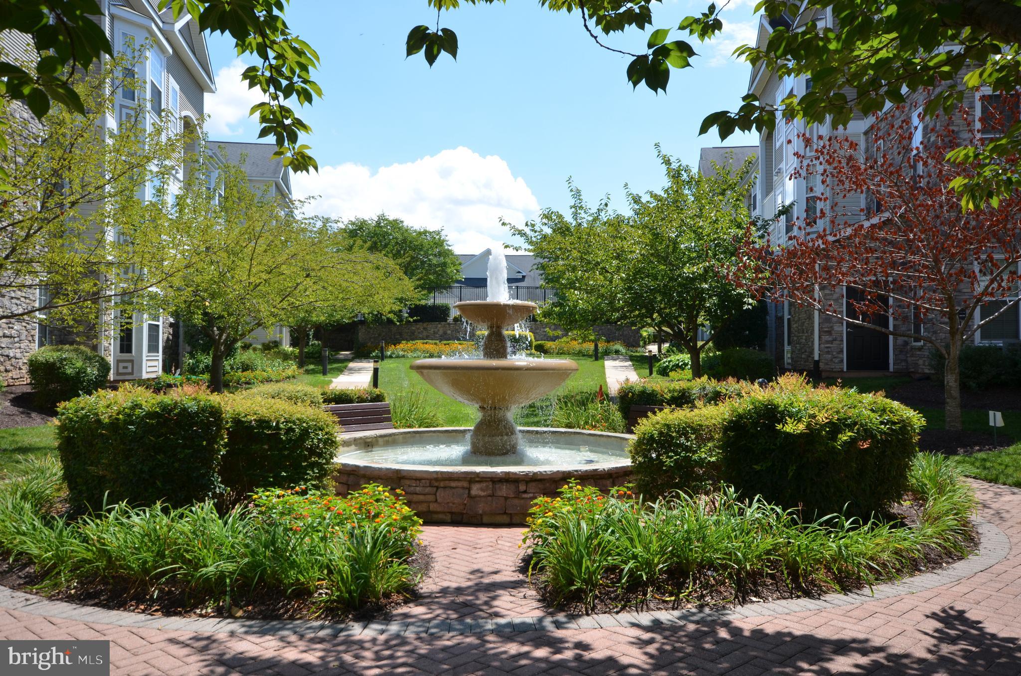 512 Sunset View Terrace Southeast, Unit 406 Leesburg, VA 20175 - Photo 30 of 34 Attractive garden details throughout community