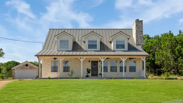 a view of a house with a yard and plants
