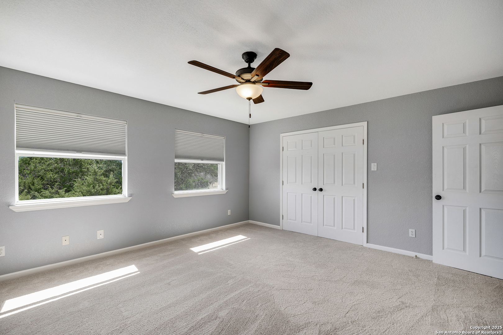 107 Ridge View Drive Boerne, TX 78006 - Photo 21 of 53 a view of a livingroom with a ceiling fan and window