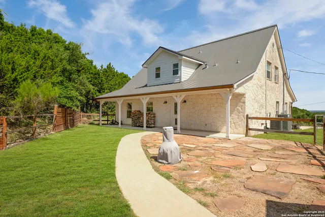 a view of a house with a backyard