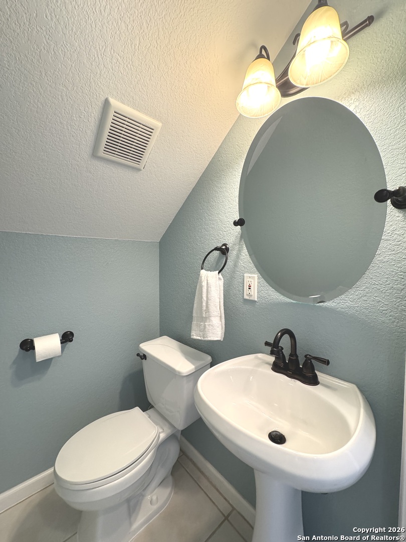 107 Ridge View Drive Boerne, TX 78006 - Photo 26 of 53 a bathroom with a toilet and a sink