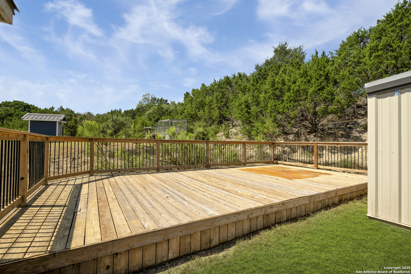 107 Ridge View Drive Boerne, TX 78006 - Photo 30 of 53 a view of a backyard with wooden floor and lake view