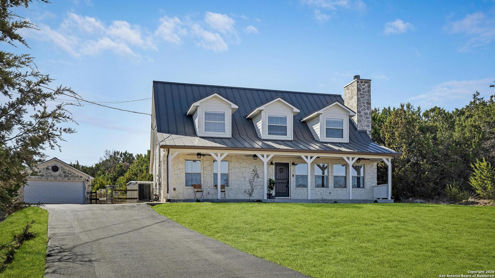 107 Ridge View Drive Boerne, TX 78006 - Photo 3 of 53 a view of a big house with a big yard and large trees