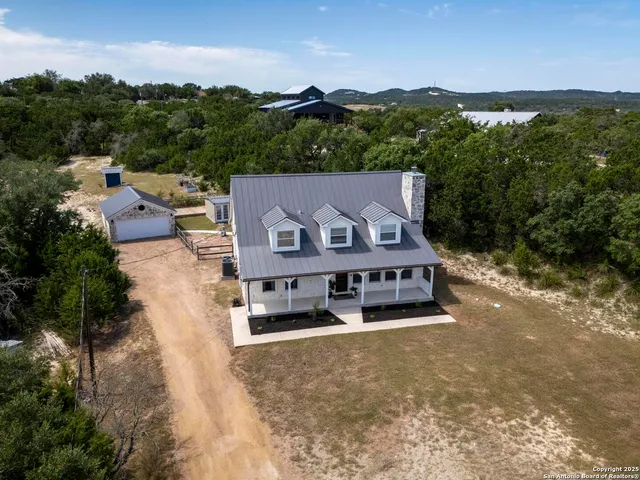 an aerial view of a house with a garden space