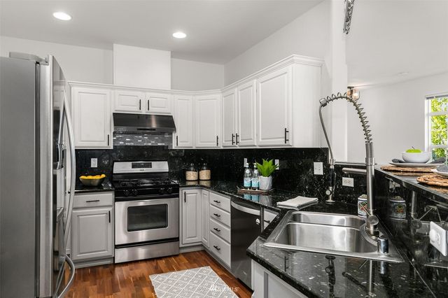 a bathroom with a toilet a sink and a mirror
