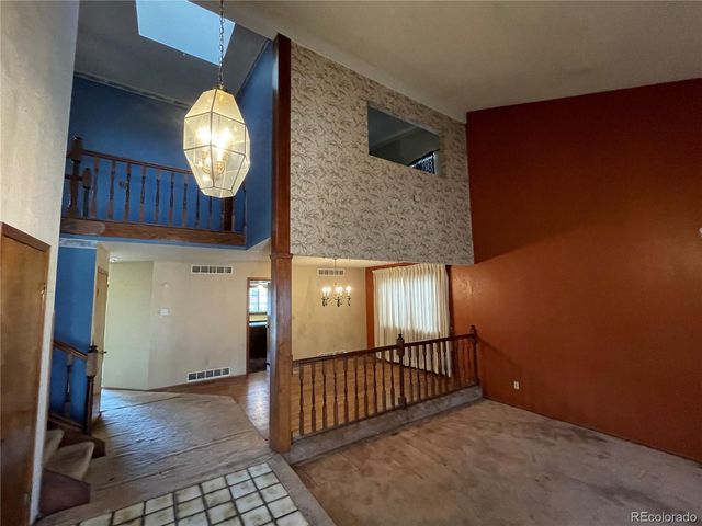 a view of a livingroom with furniture and wooden floor