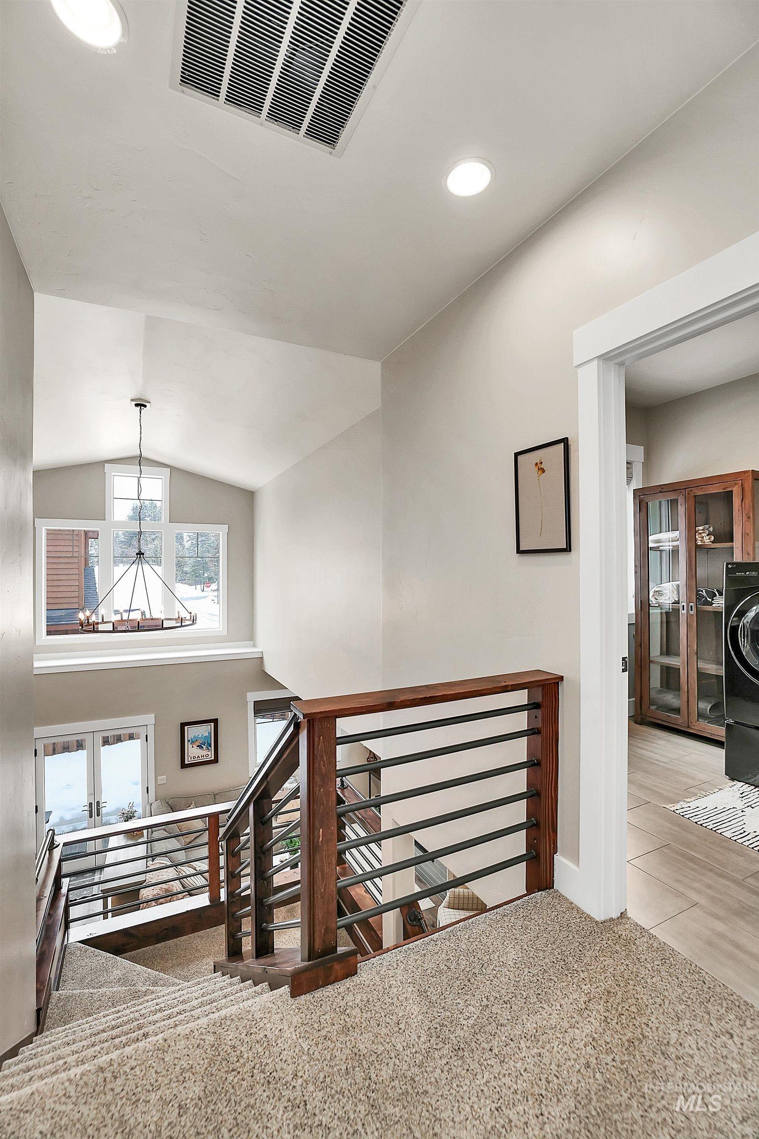 609 Blue Water Circle McCall, ID 83638 - Photo 28 of 45 Staircase with french doors, recessed lighting, and carpet