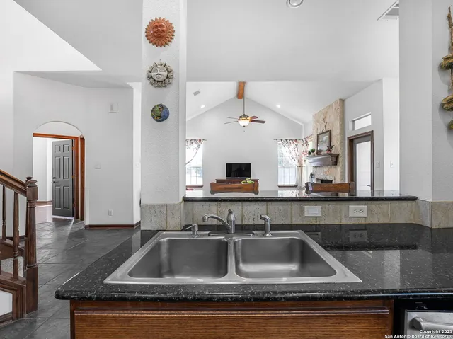 a kitchen with a sink and a refrigerator