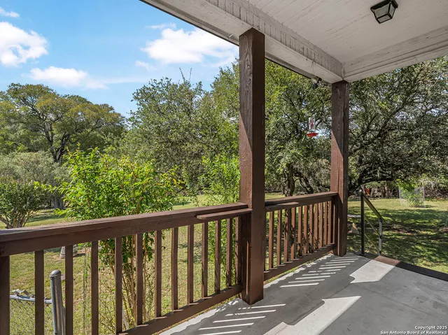 a view of a wooden balcony with outdoor space