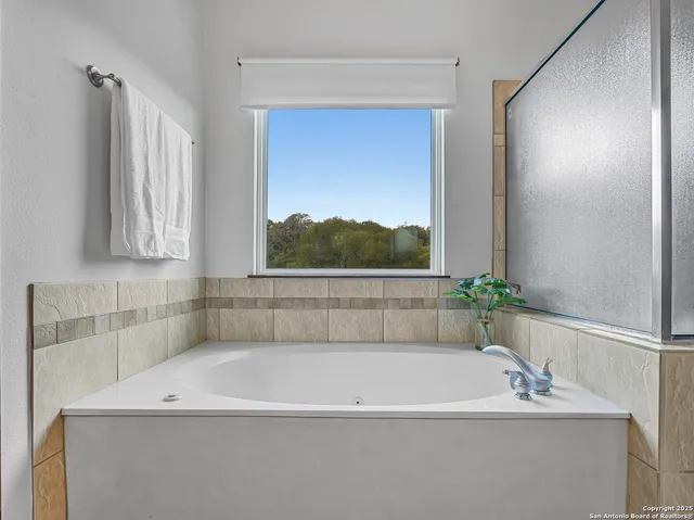 a bathroom with a bathtub and a sink