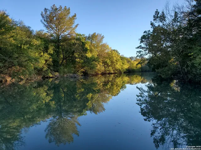 a view of lake with green space