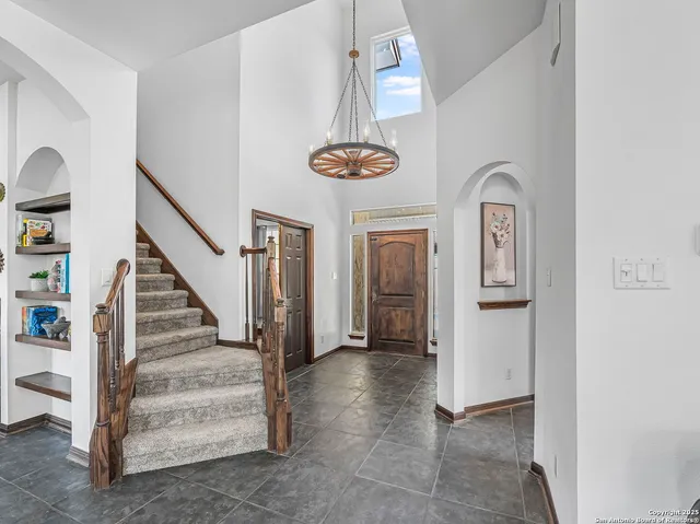 a view of entryway and hall with a front door