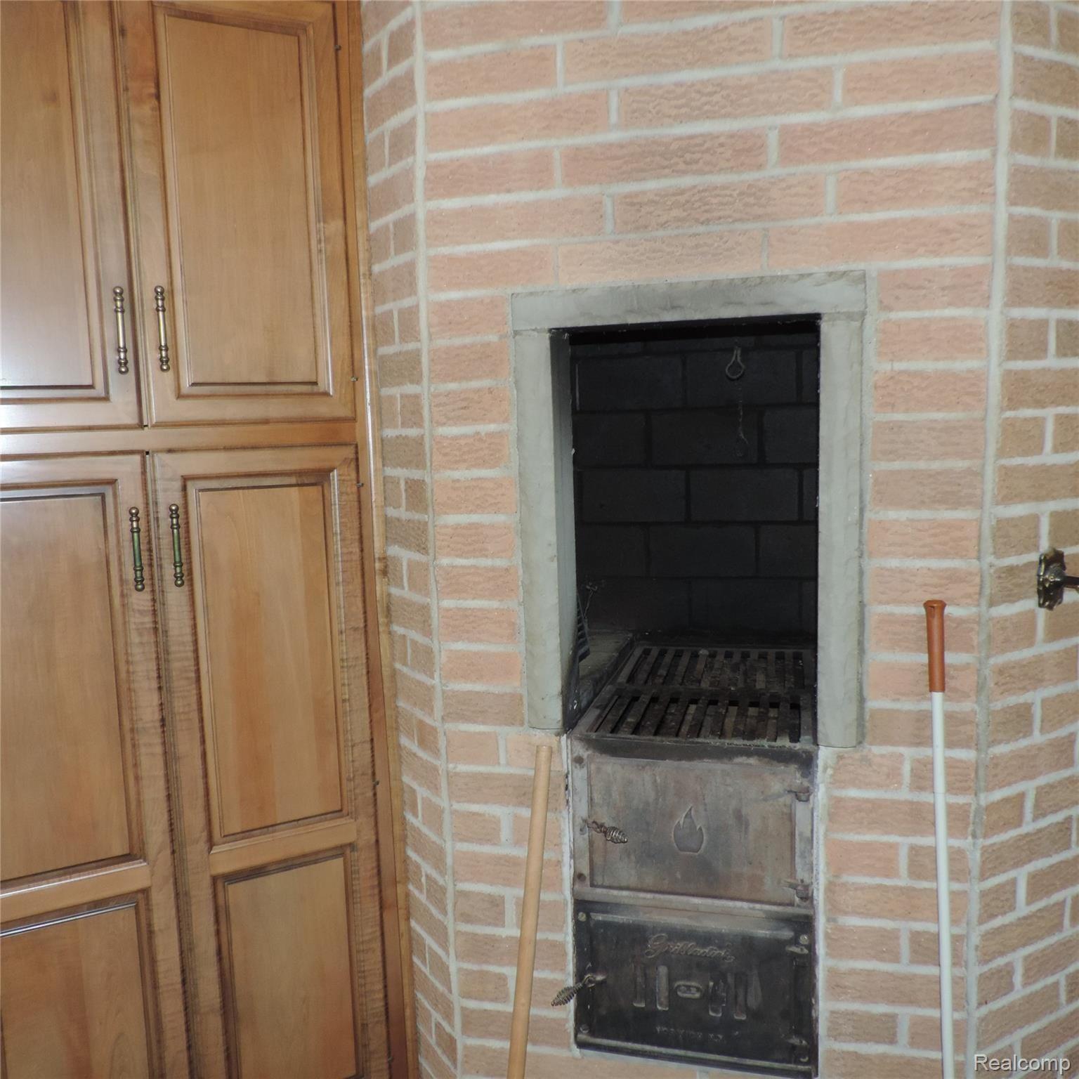 1650 West Predmore Road Oakland, MI 48363 - Photo 8 of 19 kitchen BBQ.