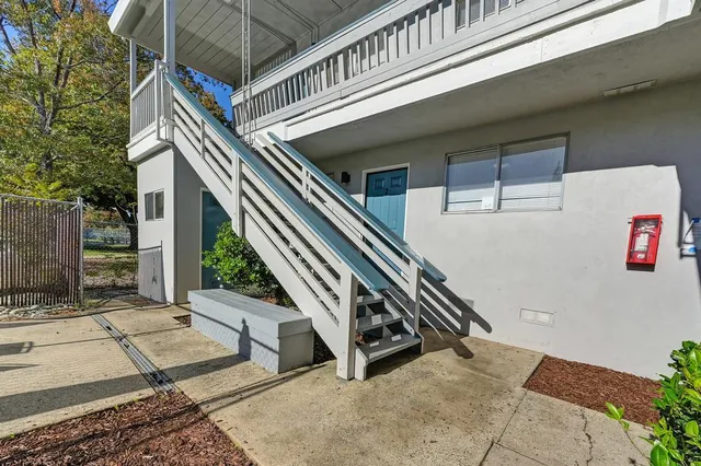 an aerial view of a residential houses with outdoor space