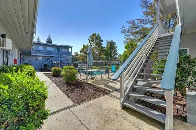 an aerial view of residential houses with outdoor space