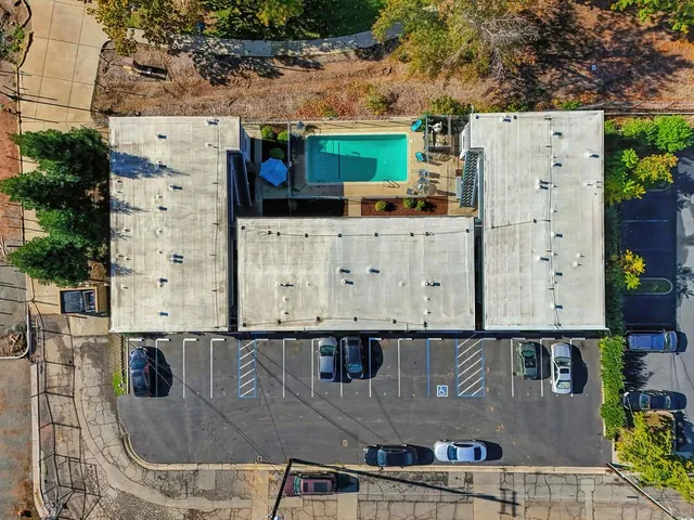 an aerial view of residential houses with city view
