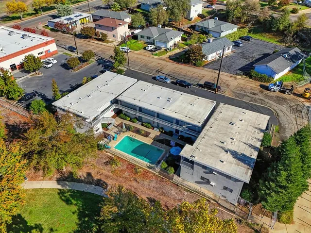 a bed room with a bed and a book shelf