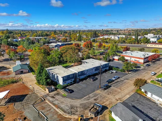 an aerial view of a house with a garden
