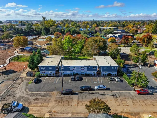 an aerial view of a house with pool table and chairs