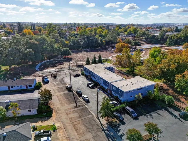 a bedroom with a bed and a ceiling fan