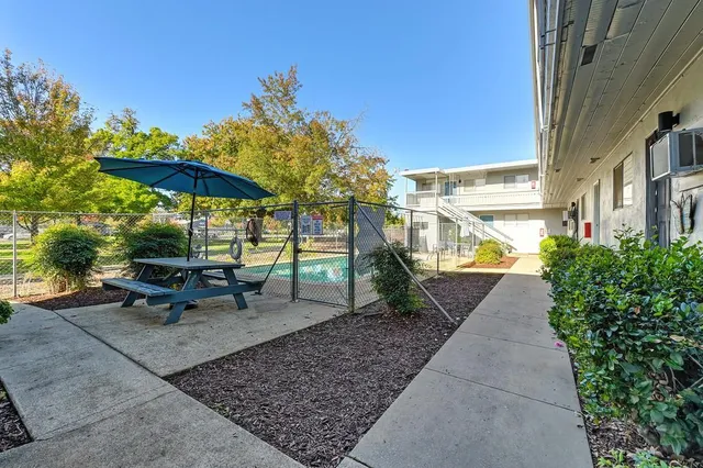 a view of a swimming pool with a patio
