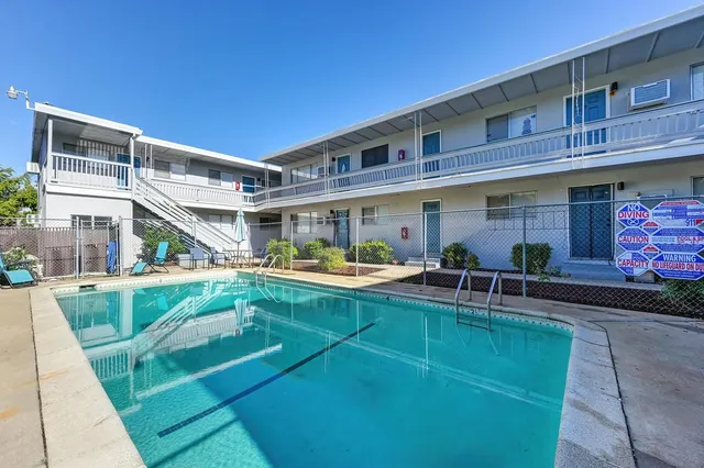 a view of a house with swimming pool