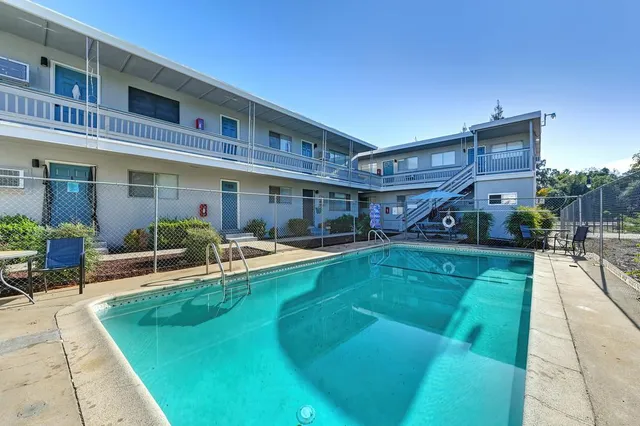 a view of a swimming pool with a patio