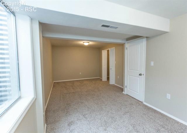 1730 Doherty Road Colorado Springs, CO 80916 - Photo 30 of 32 Bedroom #3 is quite large has a large closet to go with it