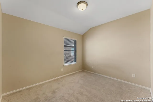 an empty room with a empty space and a window