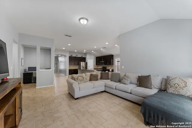 a living room with furniture and a couch