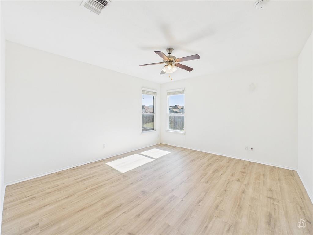 5516 Pinery Drive Waco, TX 76708 - Photo 13 of 30 an empty room with a window and a ceiling fan