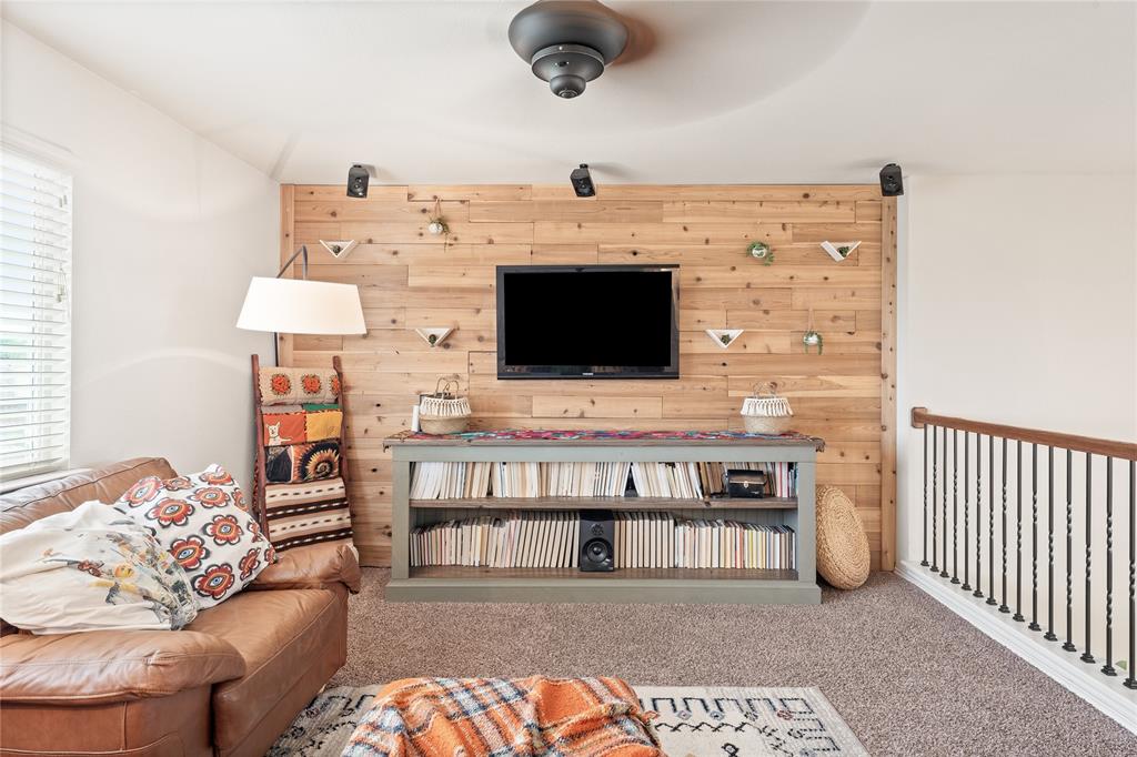 5516 Pinery Drive Waco, TX 76708 - Photo 22 of 30 a living room with furniture and a flat screen tv