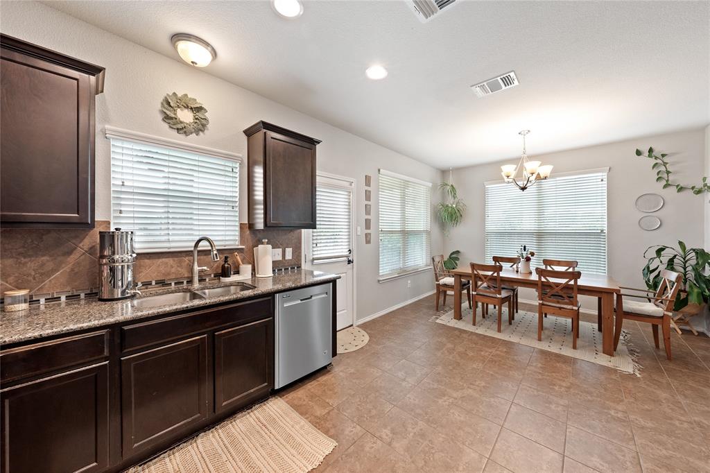 5516 Pinery Drive Waco, TX 76708 - Photo 6 of 30 a large kitchen with lots of counter space and windows