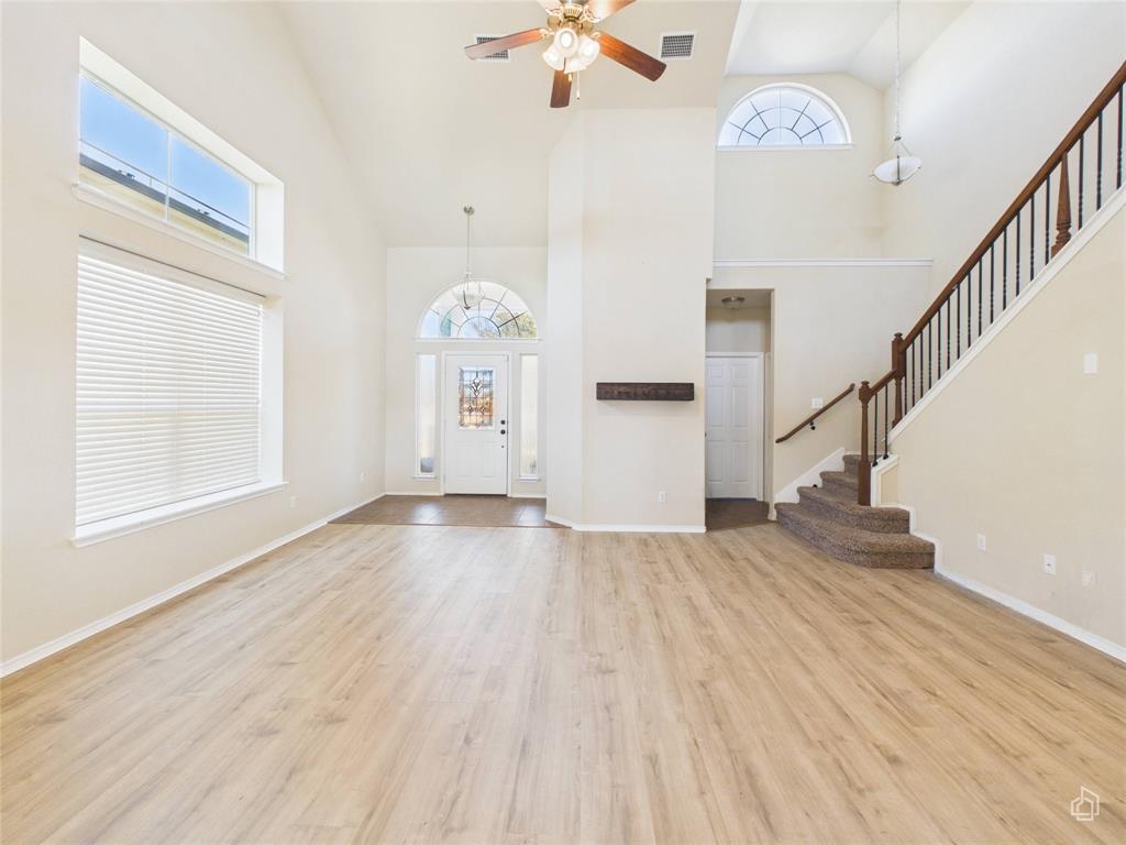 5516 Pinery Drive Waco, TX 76708 - Photo 8 of 30 a view of empty room with wooden floor and fan