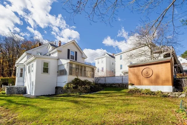 a kitchen with a refrigerator and a sink