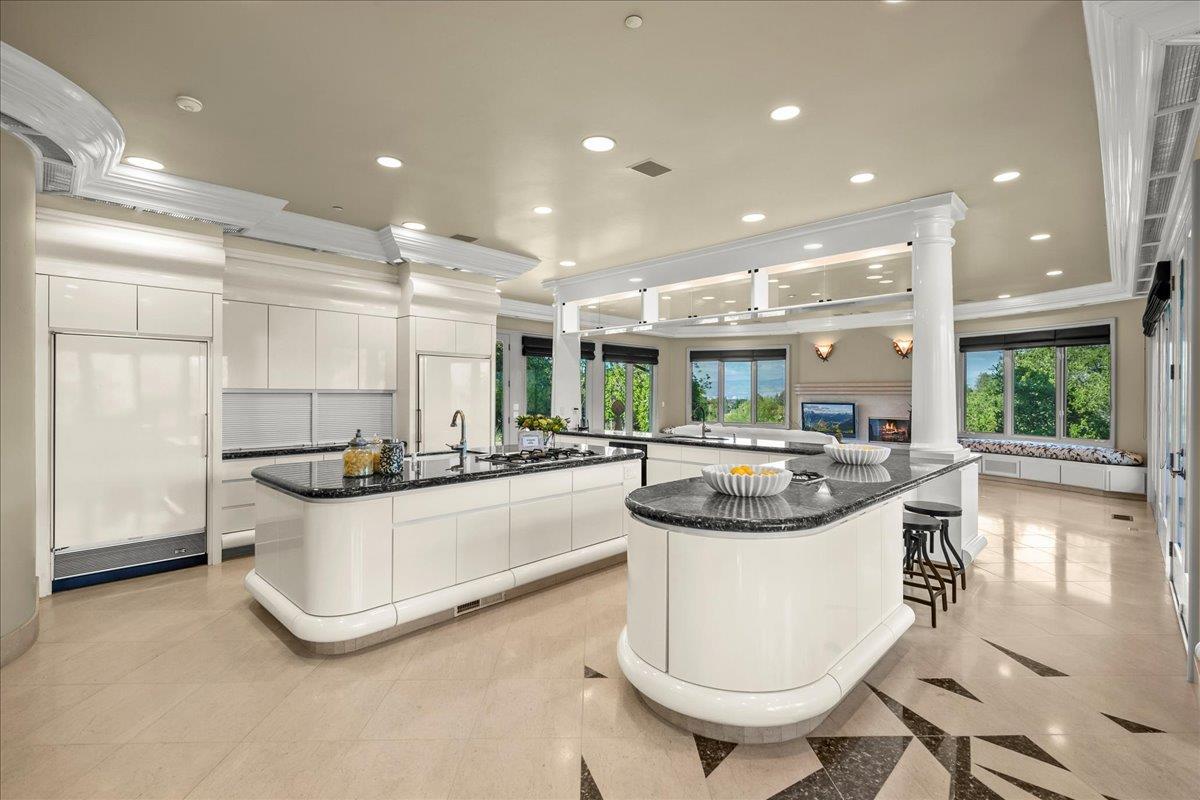14467 Sobey Road Saratoga, CA 95070 - Photo 13 of 61 a kitchen with stainless steel appliances granite countertop a sink and a refrigerator