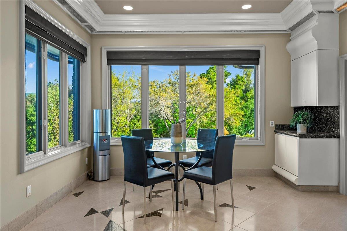 14467 Sobey Road Saratoga, CA 95070 - Photo 17 of 61 a dining room with furniture and a window